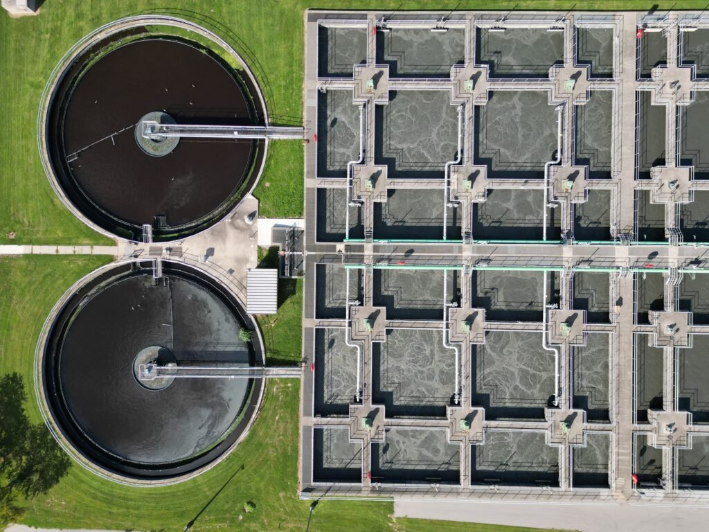 Wastewater treatment plant with circular and rectangular process tanks